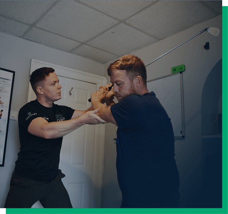 An image of Luke Thomas Neal, the Clinic Director and Chiropractor, advising a patient.